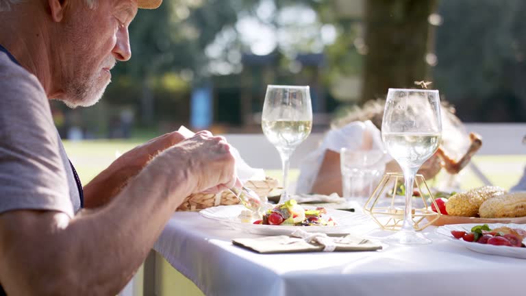 Family having a big garden party and feasting together.