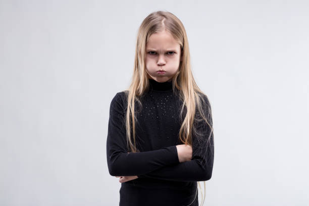 Child's pout and posture spell stubborn discontent