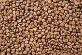 Brown pellet-based pet food for dogs and cats packed with important minerals and vitamins.