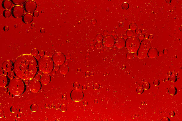istock Macro red bubble texture close-up,red macro bubbles,Backgrounds, Abstract Backgrounds, Soda, Red, Carbonated,Beauty concept background. Closeup cosmetic liquid gel with bubbles on red colors background 2019009754