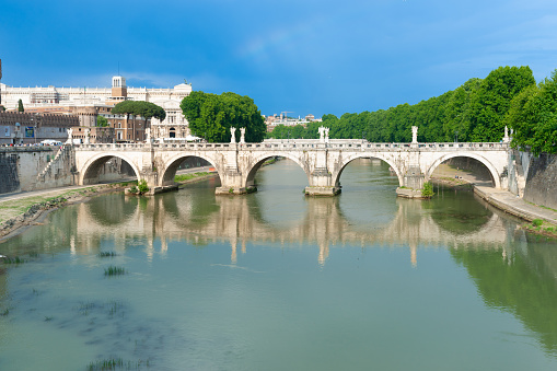 Five arches of bridge of river in Rome, Italy.