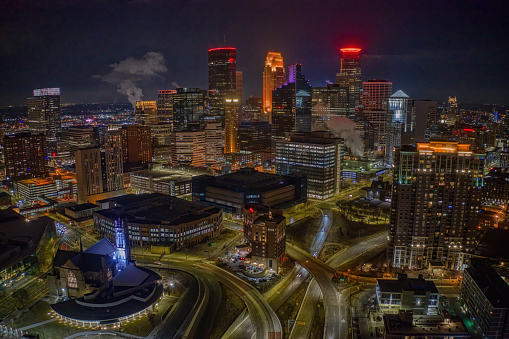 Aerial View of the Minneapolis Skyline illuminated many Colors at Night