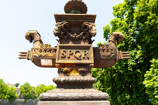 Rome Italy - May 22 2011; Ponte Giuseppe Mazzini ornate lamp  base sculpture of ancient boat with two rams heads  and letters SPQR,