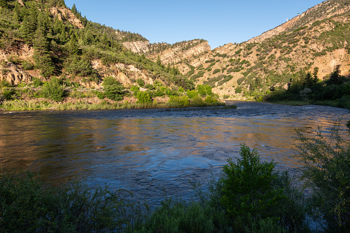 In a summer morning, the Colorado river in the Glenwood Canyon, White River National Forest (Glenwood Springs, Colorado, United-States)