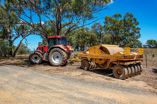 Machine used in earth works, digging and landscaping and making a road.