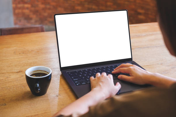 istock Mockup image of a woman working and typing on laptop computer with blank white desktop screen at home 2019266563