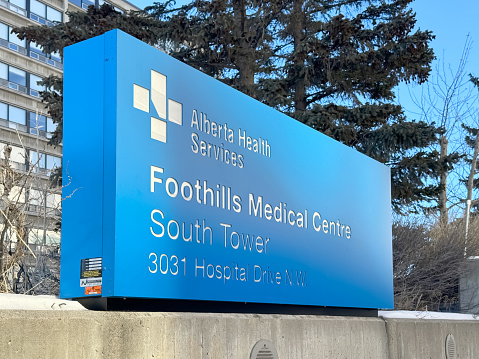 Calgary, Alberta, Canada. Feb 15, 2024. An outdoor sign of the Foothills hospital with the text: Alberta HealthServices Foothills Medical Centre.