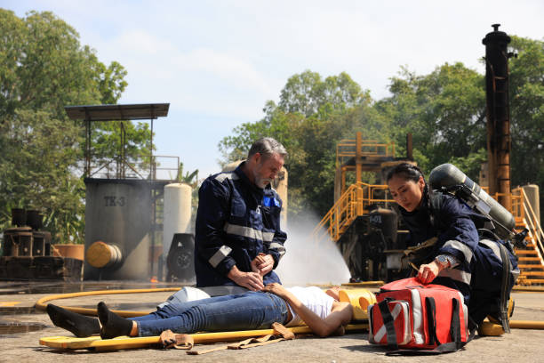 Firefighters are assisting a fire victim who has encountered an accident in Advance Fire Fighter Practice or Training
