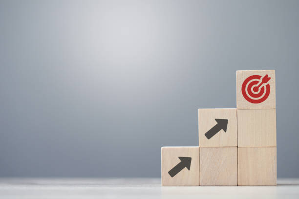 istock wood cube block with growth according to business goals 2019362183