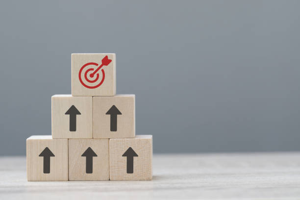 istock wood cube block with growth according to business goals 2019364210