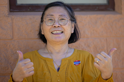 Asian woman holding a 