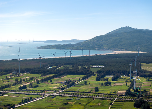 Aerial photograph of a wind farm by the sea