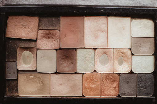 Eyeshadow palette background of soft pinks and neutral tones