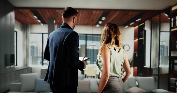 istock Woman Viewing Real Estate House 2019464848
