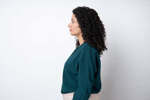 Portrait of young businesswoman with curly hairstyle wear trendy smart casual outfit isolated on white background