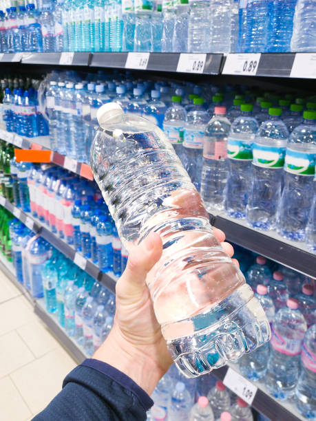 istock Drinking water in hand at shop 2019620944