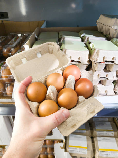 istock Hand with packages of eggs in store 2019621275