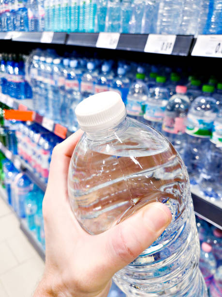 istock Drinking water in hand at shop 2019621801