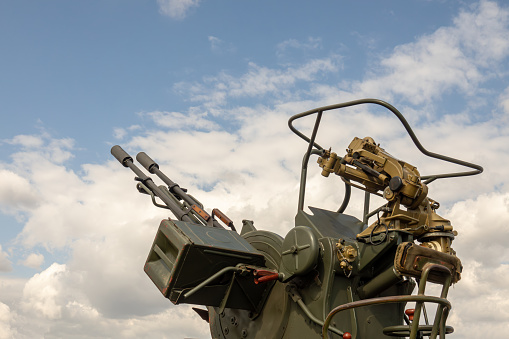 Anti aircraft artillery, double-barreled machine gun. Anti-aircraft artillery vehicle.