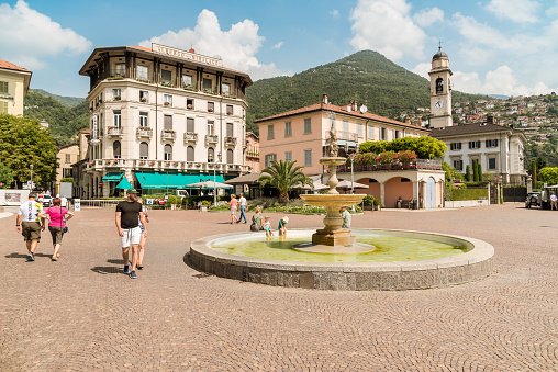 Cernobbio, Como, Italy - June 30, 2022: People visiting the Lakefront of Cernobbio, the popular holiday resort on the shore of Lake Como, Lombardy.