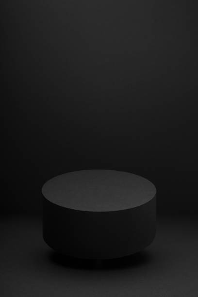 istock Soaring black round podium, mockup on black background, shadow, vertical. Template for presentation cosmetic products, gifts, goods, advertising, design, display, showing in exquisite modern style. 2019642417