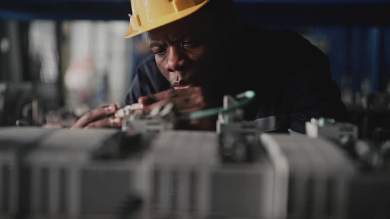 Male engineer inspecting at warehouse storage room.