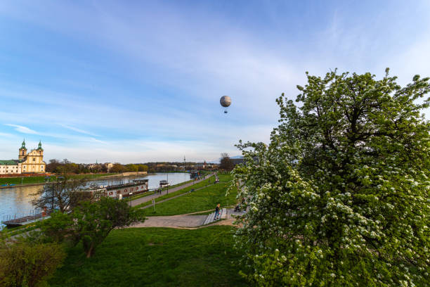 view of the vistula river, air balloon, and ferris wheel krakow eye on a sunny day. sights of krakow. - cieszyn zdjęcia i obrazy z banku zdjęć