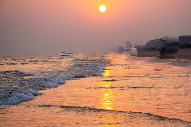 Early morning. Golden sunrise over the sea with a cloudy sky. Stormy weather