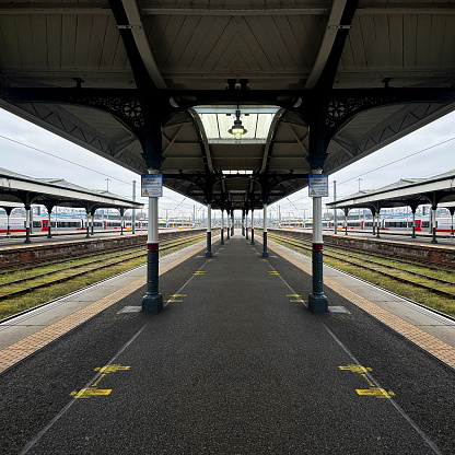 Mirror image of a platform at Norwich Station. February 2024