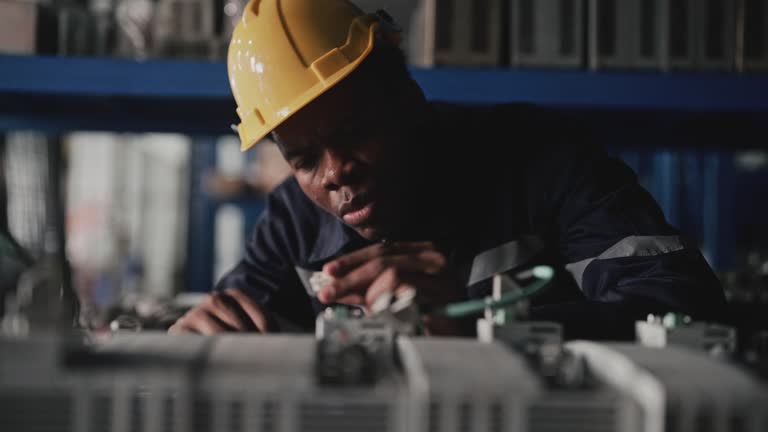 Male engineer inspecting at warehouse storage room.