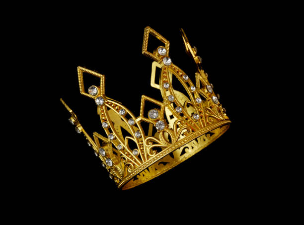 istock Gold crown isolated on black 2019720375