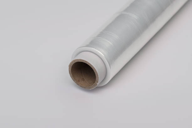 istock Isolated roller with transparent cling film wound on a paper roll close up 2019737242