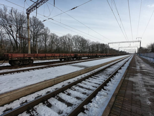 Railway freight platforms at the station on a sunny winter day.