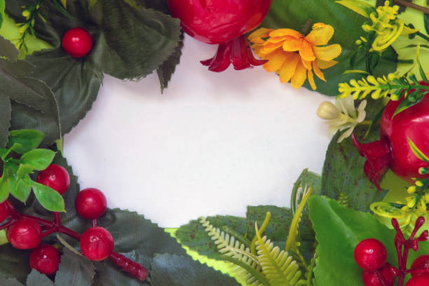 istock Flowers and leaves on white paper 2019808575