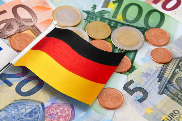 istock Euro banknotes and coins with German Flag 2019810140