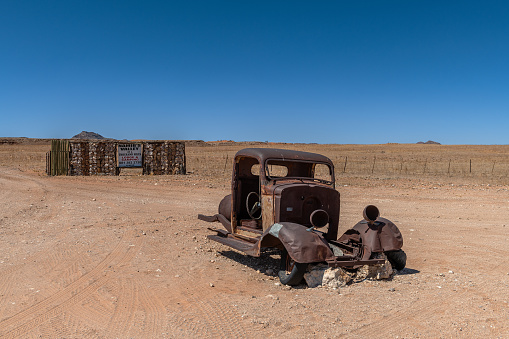 Old car wreck in Namib-Naukluft National Park, Namibianamib-naukluft national park, namibia-december 22, 2023: