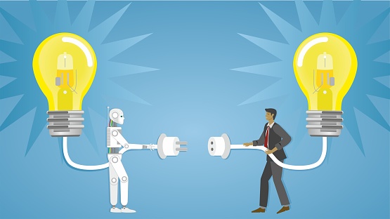 AI robot and businessman connecting their ideas. Artificial intelligence robot creating great solution.
