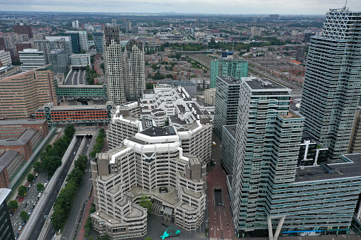 The Hague is the country's administrative centre and its seat of government, and while the official capital of the Netherlands. The image shows the city with several large office buildings, captured during summer season.