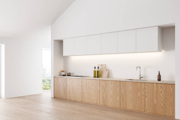 istock Stylish home kitchen interior with cooking cabinet and panoramic window 2019861855