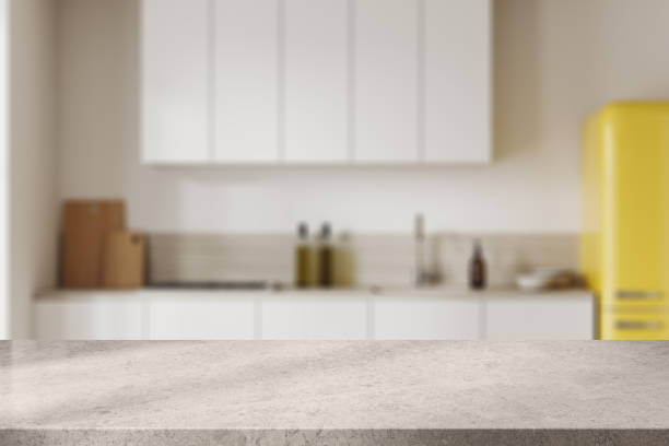 istock Stone countertop on background of kitchen interior with kitchenware. Mockup 2019878986