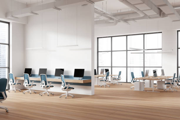 istock Office coworking interior with pc computers and armchairs in row, window 2019884363
