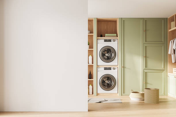 istock White and green laundry room interior with blank wall 2019887547