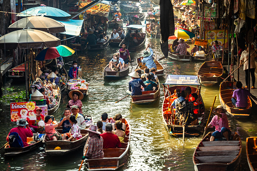 Ratchaburi, Thailand - February 2, 2024 : Damnoen Saduak Floating Market Tourists Visiting By Boat.