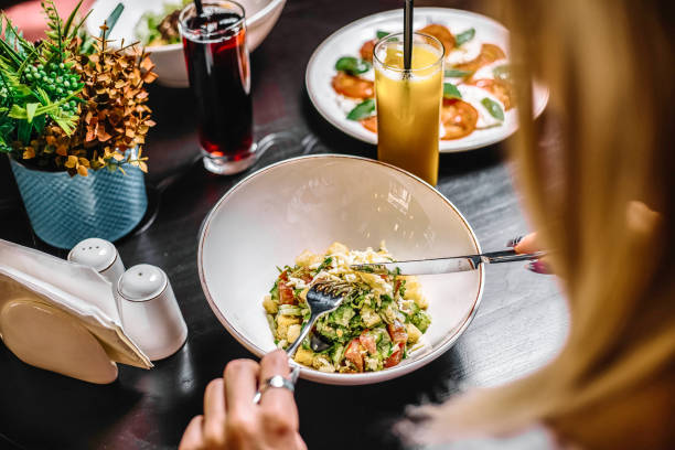 istock Woman Enjoying a Meal at a Table 2019923889