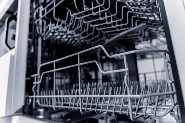 istock The white kitchen and opened dishwasher with clean dishes 2019931944