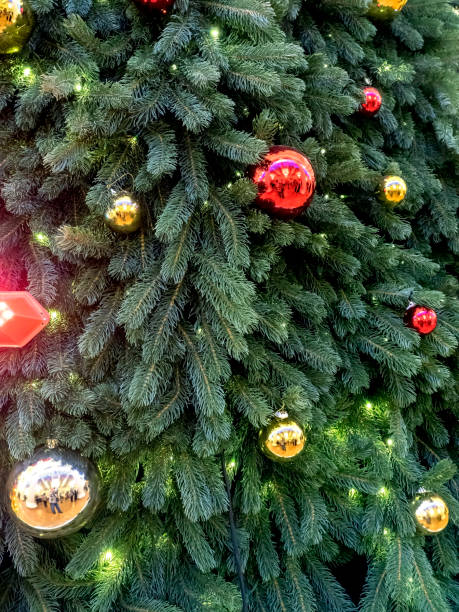 istock colorful Christmas tree toys on a Christmas tree 2019954525