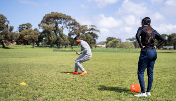 Soccer players training on sports field