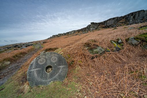 Stanage Edge millstones in the Derbyshire Peak District National Park during winter.