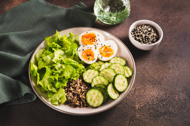 istock Fitness plate with quinoa, cucumber, egg and lettuce on the table 2020047051