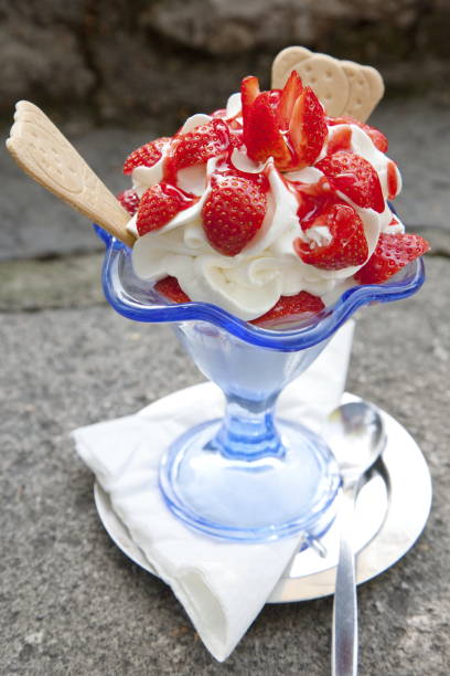 istock yogurt ice cream with cream and fresh strawberries 2020064277